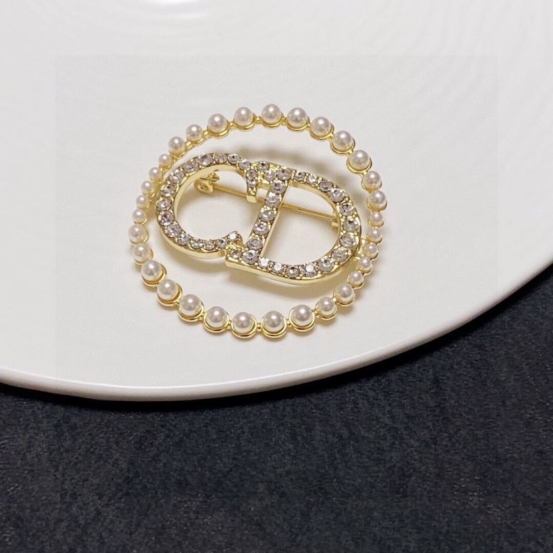ch**an D*or brooches